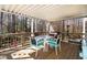 A charming back deck featuring an outdoor table with chairs, a grill, and outdoor patio heater at 166 Creek Dr, Louisburg, NC 27549