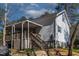 Inviting backyard featuring a spacious deck with stairs, perfect for outdoor gatherings at 166 Creek Dr, Louisburg, NC 27549