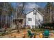 Relaxing backyard featuring a covered deck with stairs, enhancing outdoor enjoyment at 166 Creek Dr, Louisburg, NC 27549