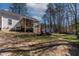 Expansive backyard featuring a covered deck, perfect for outdoor entertaining and relaxation at 166 Creek Dr, Louisburg, NC 27549