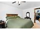Bedroom with a wood headboard and dark-stained furniture at 166 Creek Dr, Louisburg, NC 27549