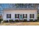 Charming single-story home with a blue door, black shutters, and a well-manicured front yard at 166 Creek Dr, Louisburg, NC 27549