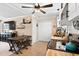 Open kitchen with wood table, white cabinets, and black appliances at 166 Creek Dr, Louisburg, NC 27549