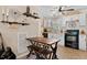 Cozy eat-in kitchen with wooden dining table, black appliances, and white cabinets at 166 Creek Dr, Louisburg, NC 27549