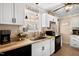 The kitchen features a stainless steel sink, bright window, and butcher block countertop at 166 Creek Dr, Louisburg, NC 27549