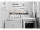 Clean and efficient laundry room with modern washer and dryer at 166 Creek Dr, Louisburg, NC 27549