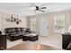 Comfortable living room with a cozy sofa and plenty of natural light streaming through the windows at 166 Creek Dr, Louisburg, NC 27549