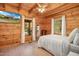 Relaxing main bedroom with wood paneling, and natural light at 171 Robert Whitfield Rd, Hurdle Mills, NC 27541