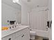 Bathroom with a vanity, toilet, and shower with a curtain at 180 Normandy Rd, Louisburg, NC 27549