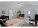 Bedroom with a walk-in closet, TV, and a view into the en-suite bathroom at 180 Normandy Rd, Louisburg, NC 27549