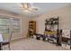 Bedroom with a large window, ceiling fan, carpet, and decor at 180 Normandy Rd, Louisburg, NC 27549
