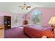 Bedroom with large window and a queen bed at 180 Normandy Rd, Louisburg, NC 27549