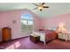 Bedroom with a queen bed and large window at 180 Normandy Rd, Louisburg, NC 27549