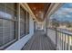 Inviting covered front porch with wood ceiling, rocking chair, and ample space for relaxing outdoors at 180 Normandy Rd, Louisburg, NC 27549