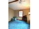Bedroom with blue carpeting, an armchair, and a dark wood headboard and dresser at 182 Tree Cutters, Sanford, NC 27332