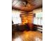 Cozy bedroom featuring wood-paneled walls, ceiling fan, and natural light at 182 Tree Cutters, Sanford, NC 27332