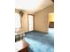 View of a carpeted bedroom with neutral walls and a white entry door at 182 Tree Cutters, Sanford, NC 27332