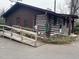 Exterior of home featuring a ramp, and log-cabin style siding at 182 Tree Cutters, Sanford, NC 27332