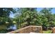 Breathtaking lake view from the wooden deck, surrounded by lush trees and serene water at 182 Tree Cutters, Sanford, NC 27332