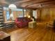 Comfortable living room showcasing wood floors, a cozy sofa, and natural light at 182 Tree Cutters, Sanford, NC 27332
