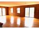 Spacious living room featuring hardwood flooring, wood paneling and sliding glass doors for natural light at 182 Tree Cutters, Sanford, NC 27332