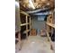 Unfinished basement storage area with shelving at 182 Tree Cutters, Sanford, NC 27332