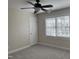 Comfortable bedroom featuring a ceiling fan, neutral walls, and bright natural light at 1904 Baronsmede Dr, Raleigh, NC 27615