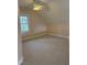 Bonus room featuring neutral decor, a unique angled ceiling, and soft carpeting at 1904 Baronsmede Dr, Raleigh, NC 27615
