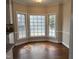 Bright breakfast nook featuring hardwood floors and a bay window offering beautiful views at 1904 Baronsmede Dr, Raleigh, NC 27615