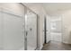 Clean, bright bathroom with glass shower, white walls, and wood floors at 209 Leven Dr, Gibsonville, NC 27249