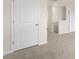 Hallway featuring plush carpet, neutral walls, and bright white trim at 209 Leven Dr, Gibsonville, NC 27249