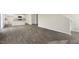 Open living room with gray wood-look floors open to the kitchen at 209 Leven Dr, Gibsonville, NC 27249
