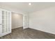 Versatile room with French doors and wood-look flooring, perfect for a home office at 209 Leven Dr, Gibsonville, NC 27249