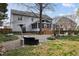 Spacious backyard with manicured landscaping, patio area, and cozy screened-in porch at 209 Plyersmill Rd, Cary, NC 27519