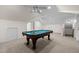 Finished basement featuring a billiards table with overhead lighting and neutral colored walls at 209 Plyersmill Rd, Cary, NC 27519