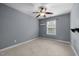 Empty bedroom featuring a ceiling fan and a window at 209 Plyersmill Rd, Cary, NC 27519