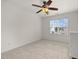 Unfurnished bedroom with carpeted floors, a ceiling fan, and a large window at 209 Plyersmill Rd, Cary, NC 27519