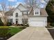 Charming two-story home features a two-car garage, well-maintained lawn and beautiful landscaping at 209 Plyersmill Rd, Cary, NC 27519