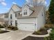 Charming two-story home features a two-car garage, well-maintained lawn and beautiful landscaping at 209 Plyersmill Rd, Cary, NC 27519
