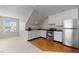 Kitchenette with stainless steel appliances and light brown countertops with hardwood flooring at 209 Plyersmill Rd, Cary, NC 27519