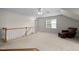 Bright room featuring a light carpet, ceiling fan, and brown leather couch at 209 Plyersmill Rd, Cary, NC 27519