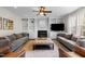 Living room with fireplace, built-in bookshelves, and plush seating at 209 Plyersmill Rd, Cary, NC 27519