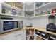Organized pantry with custom shelving and storage baskets, providing ample space for food and appliances at 209 Plyersmill Rd, Cary, NC 27519
