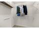 Organized walk-in closet with shelves and hanging rods for ample storage at 209 Plyersmill Rd, Cary, NC 27519