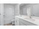Bathroom featuring double sinks, a tub, and modern fixtures at 215 Leven Dr, Gibsonville, NC 27249