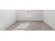 Bright bedroom with wood floors, white walls, and a window that lets in natural light at 215 Leven Dr, Gibsonville, NC 27249
