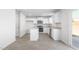 Bright kitchen featuring white cabinets, granite countertops, and stainless steel appliances at 215 Leven Dr, Gibsonville, NC 27249