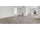 Open floor plan featuring wood floors, white walls, with a view of the kitchen and bathroom at 215 Leven Dr, Gibsonville, NC 27249
