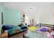 Shared bedroom featuring colorful decor, and comfortable sleeping arrangements at 224 Swann Trl, Clayton, NC 27527