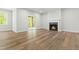 Finished basement area with fireplace, sliding glass doors, and wood-look flooring at 230 Sutherland Dr, Franklinton, NC 27525